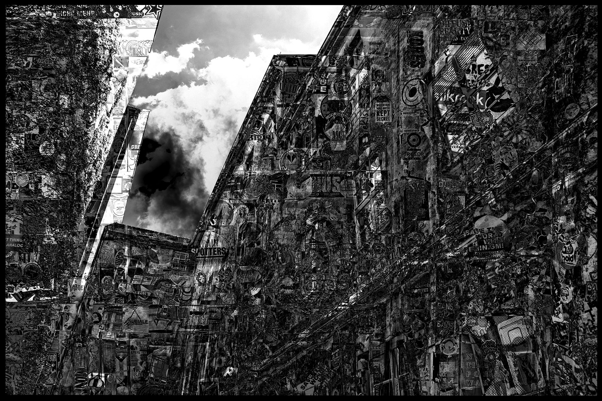 The picture shows artistically alienated house facades with a view of a darkening sky. The house facades are massively overlaid with stickers, posters and graffiti, creating a new surface texture.