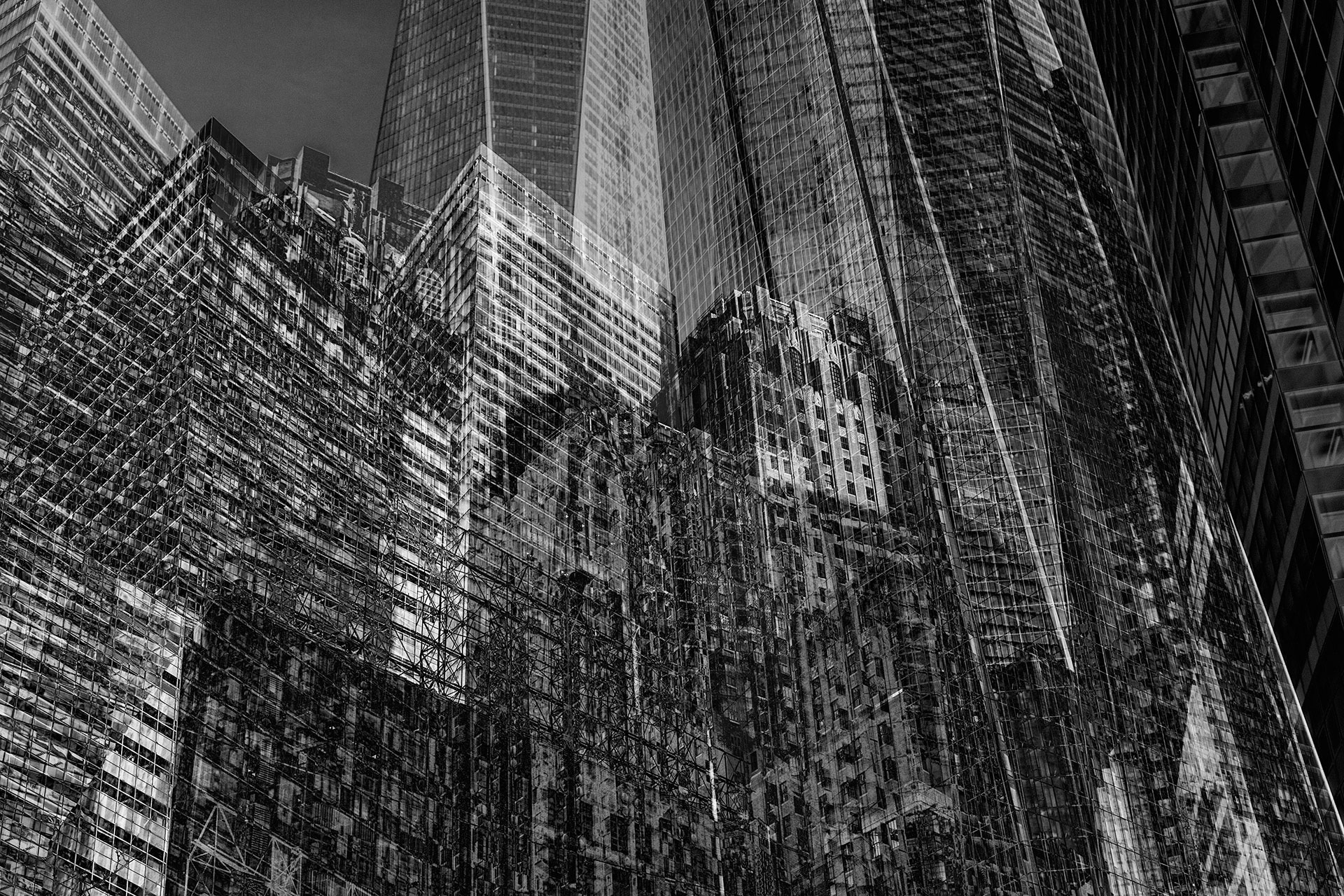 Several skyscrapers from New York City overlay the black and white art photography.