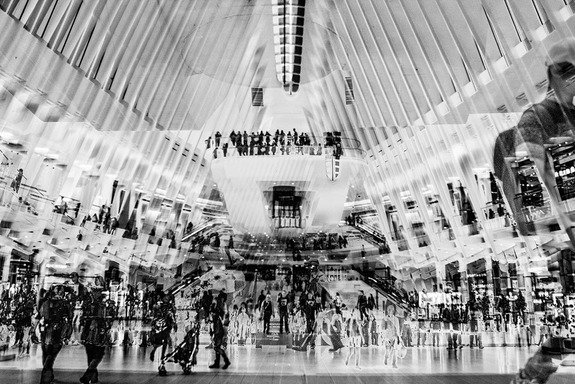 The many people in the One World Trade Center Station are multiplied again by the artistic interpretation.