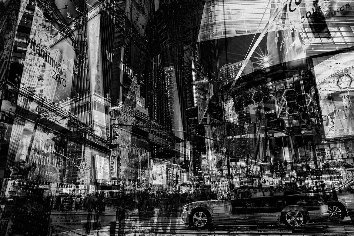 Wall Street at night. Neon signs, cars and skyscrapers are condensed in the image by superimposition.